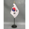South Korea 4x6" fine polyester flag, hemmed on all sides and mounted to a 10" black plastic staff with a gold spear top.