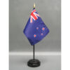 4 in. X 6 in. New Zealand Mounted on a 10 in. Black Staff with Gold Spear tip.